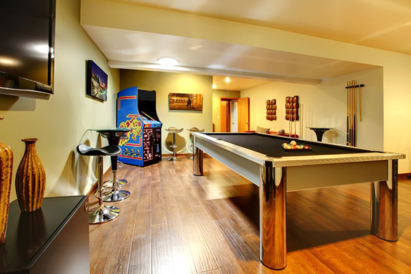Game room with pool table and arcade