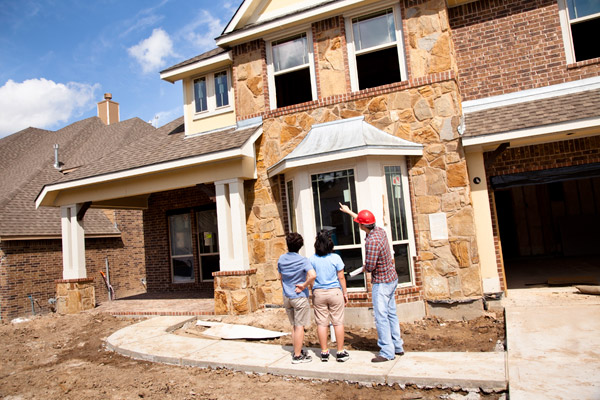 Contractor Talks to Couple Home Construction