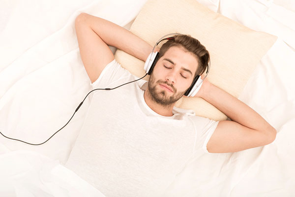 Man listening to music with eyes closes